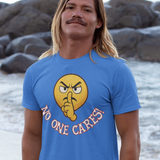 Man wearing a blue t-shirt with a graphic design on a beach